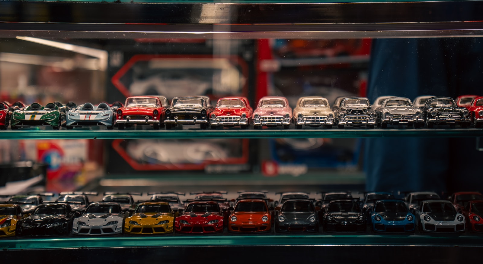Diecast model car collection in a display case